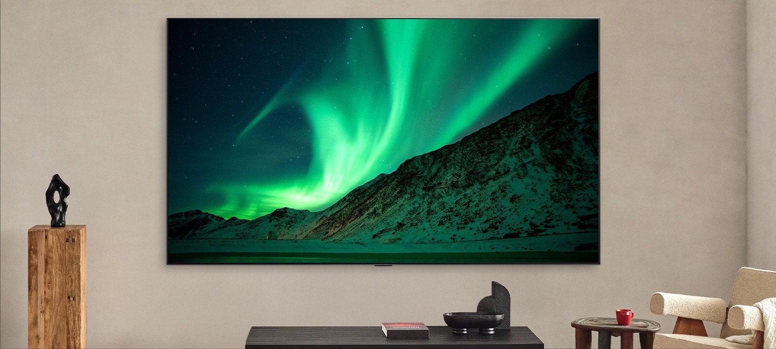 LG TV in a modern living space during the day. Label says, day. AI Brightness Control ensures the picture of the aurora borealis on the TV is displayed with the perfect brightness level for the light in the room. 